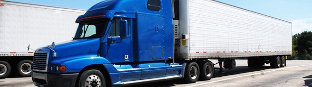 blue semi truck and trailer parked